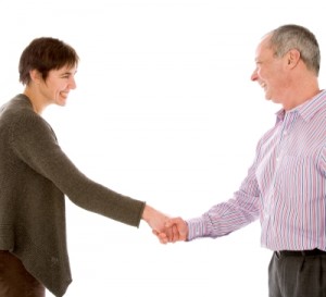 Chris Kenber shakes hands with a happy client