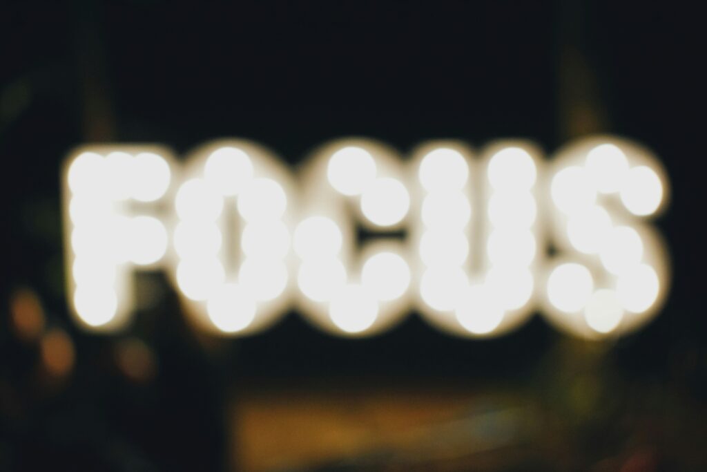 A sign that reads ‘FOCUS’, slightly out of focus
